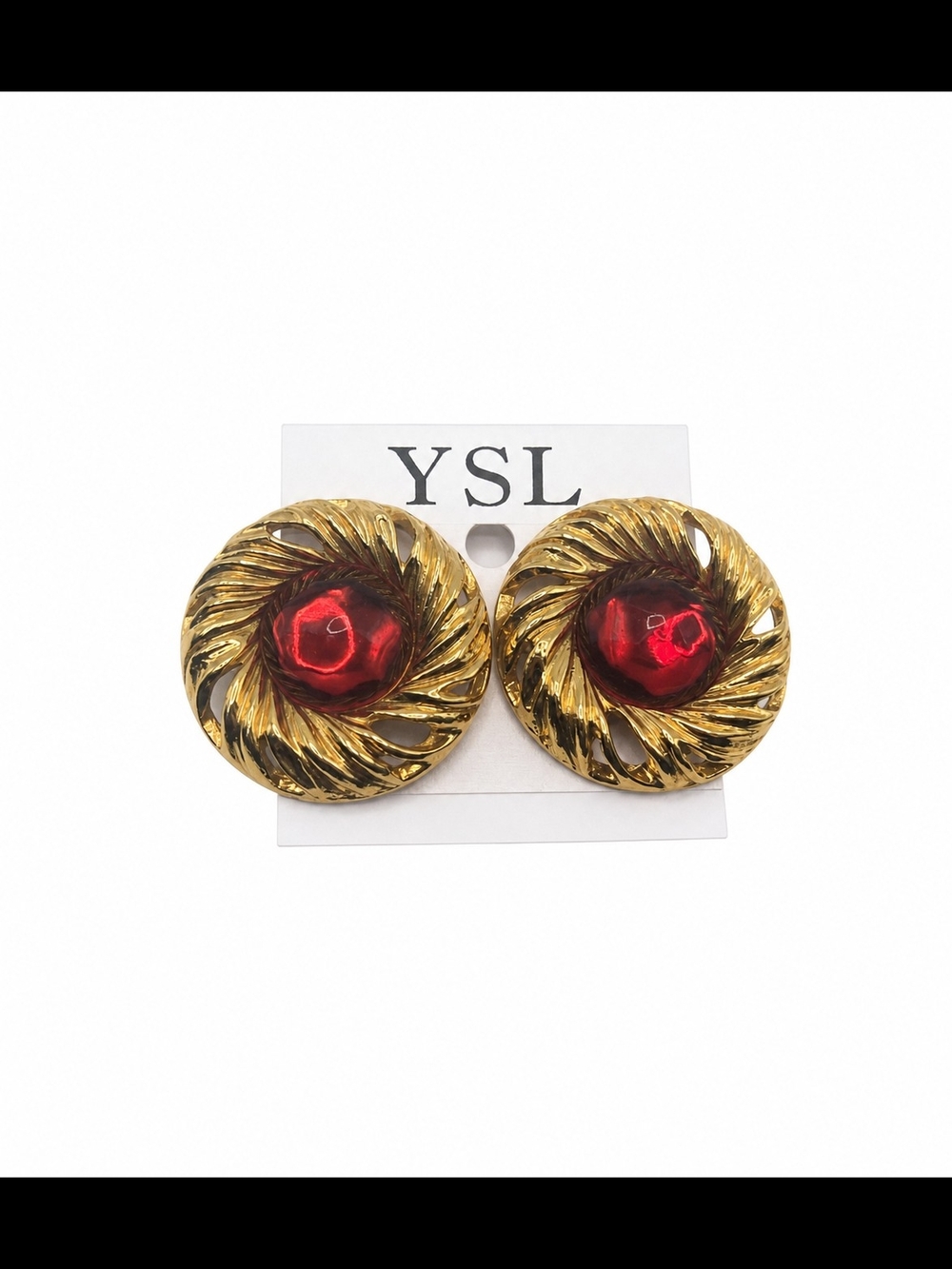 Vintage Yves Saint Laurent Gold-Tone Swirl Clip On Earrings with Red Cabochons.